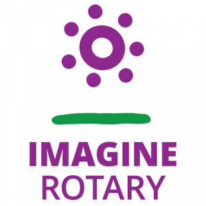 Purple sun over grass with words IMAGINE ROTARY